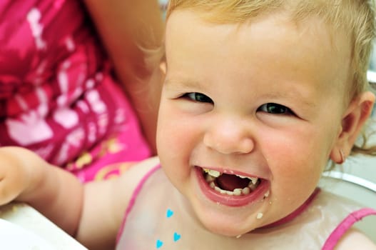 face of happy eating sweet baby girl 