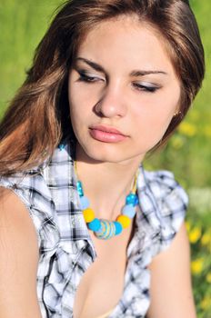 portrait of tender teen girl wearing necklace