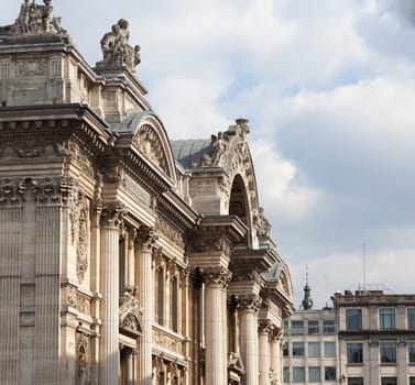 Facade of the Bourse in Brussels with the carved entrance arch