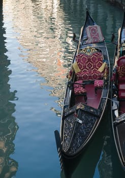 Venetian gondola and reflections in a channel