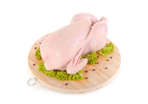 Fresh raw chicken on wooden board, isolated on white background 