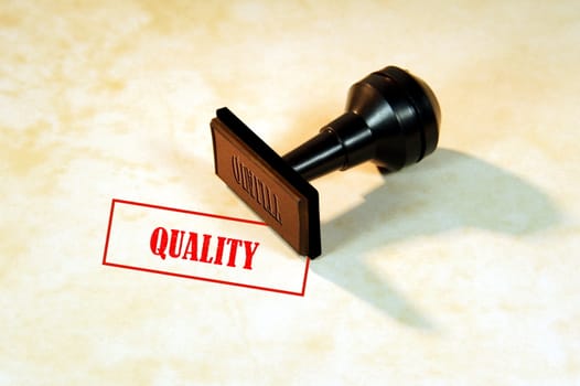 A Rubber stamp with the print "Quality" on textured paper







Ruber stamp