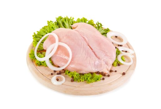 Fresh raw chicken breasts on chopping board, clipping path included 