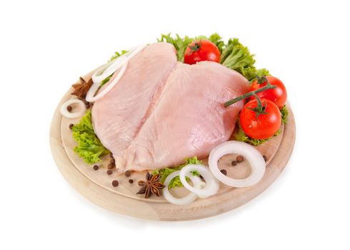 Fresh raw chicken breasts with vegetables, clipping path included 