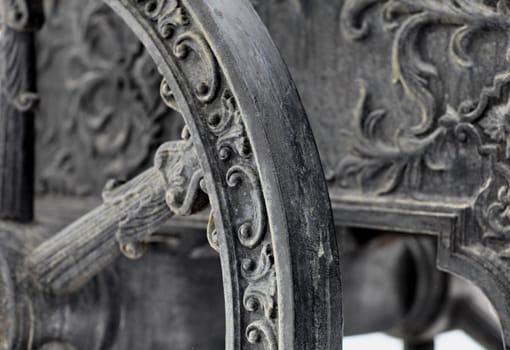 The old medieval bronze cannon on the gun carriage