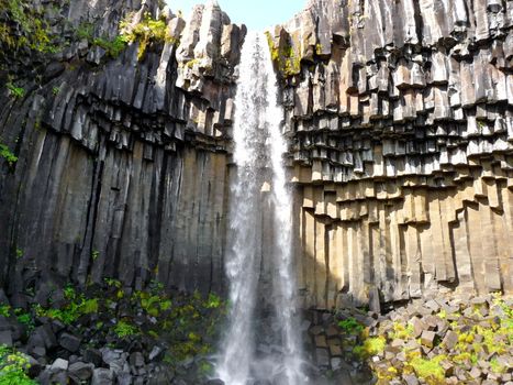 Skaftafell Iceland waterfall, cascade on basalt volcanic  rock