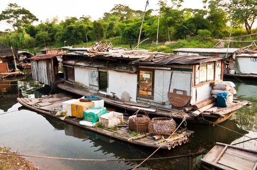 Rural slum favela houseboar in China  river