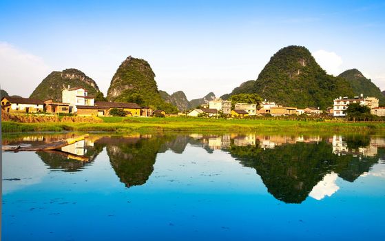 Chinese village view  relecting inside Li river