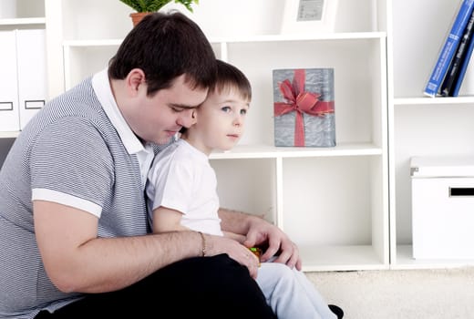 Father and son spend time together, playing at home