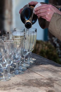 pouring champagne for a toast at a family reception