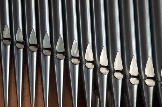 close, almost abstract shot of organ pipes in a church