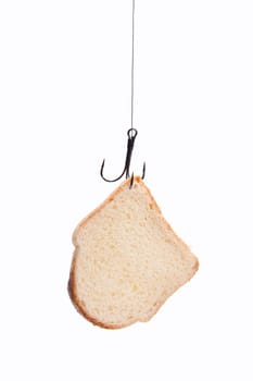 piece of white bread hanging on a fishing hook. isolated