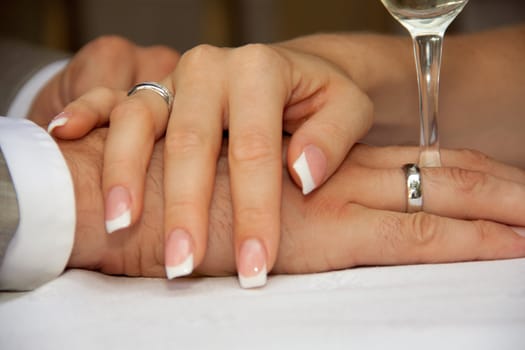 groom holding a glass. bride groom holding hands