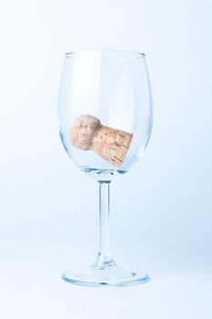 glass of wine with a cork from a bottle