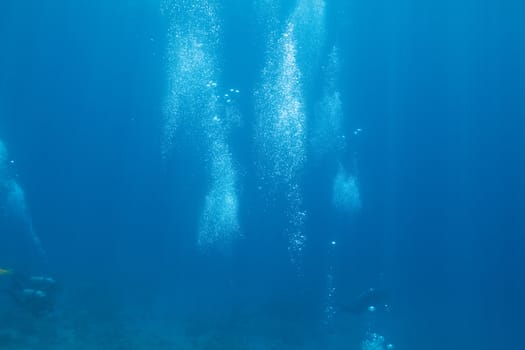 background of bubbles of divers in deep water