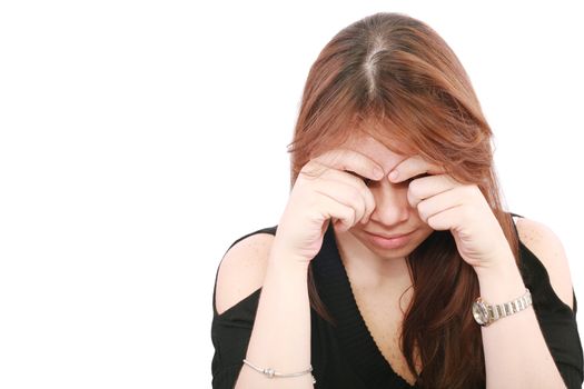 Young business woman looking worried at desk on white background