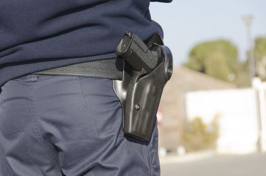 police officer carrying a weapon