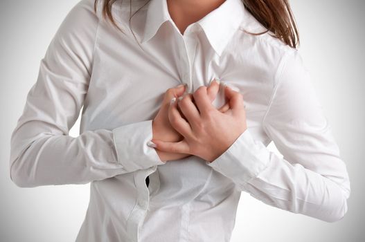 Woman having a pain in the heart area