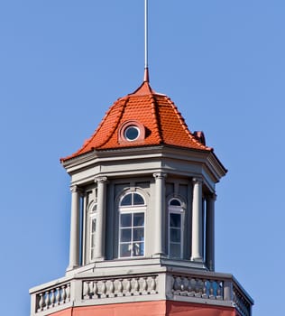 Brown tile capped tower at day