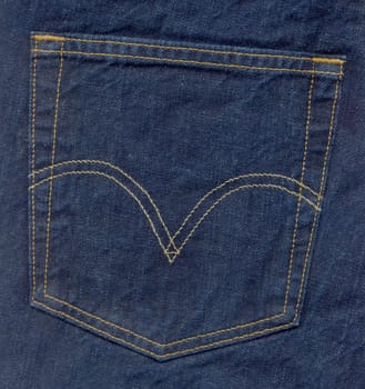 Close up of denim blue jeans back pocket