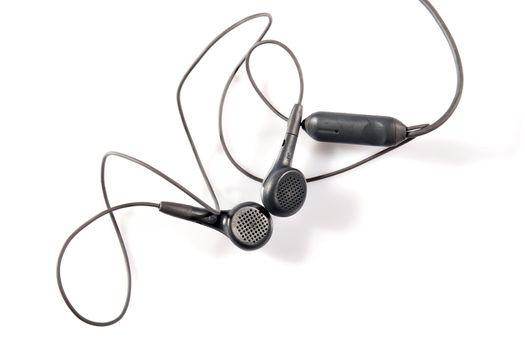 A pair of grey earphones on white background