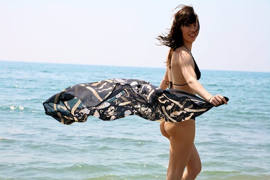 woman in bikini in the water smiling