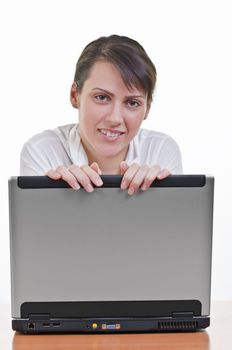 Portrait of happy mature business woman with a laptop computer, high key, eye contact