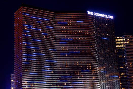 Las Vegas, USA - November 30, 2011: The Cosmopolitan of Las Vegas is a casino and hotel that opened in 2010 on the famous Las Vegas Strip.  Pictured here is the highrise hotel tower with parallel blue lights at night.