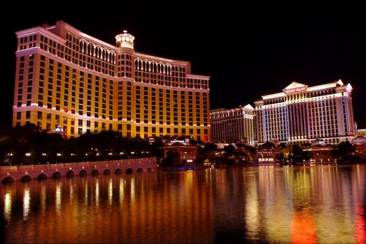 Las Vegas, USA - November 30, 2011: Bellagio is a hotel and casino located on the famous Las Vegas Strip.  A large fountain pool is situated in front of the hotel with neighboring Caesars Palace Hotel and Casino seen on the right in the distance.