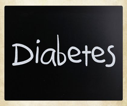 The word "Diabetes" handwritten with white chalk on a blackboard
