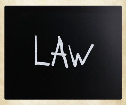 The word "Law" handwritten with white chalk on a blackboard
