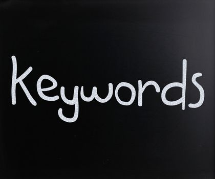 The word "Keywords" handwritten with white chalk on a blackboard