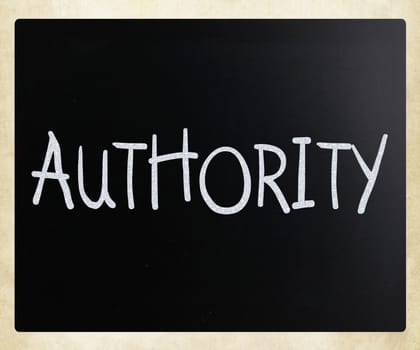 "Authority" handwritten with white chalk on a blackboard