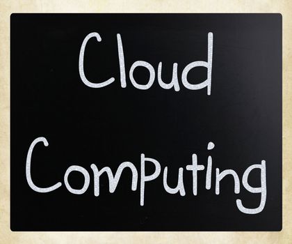 "Cloud computing" handwritten with white chalk on a blackboard