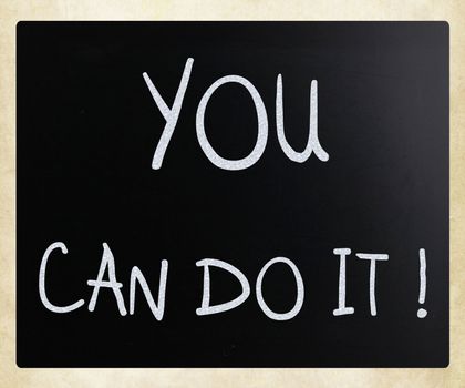 "You can do it" handwritten with white chalk on a blackboard