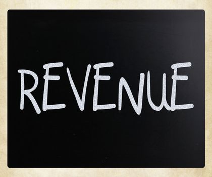 "Revenue" handwritten with white chalk on a blackboard