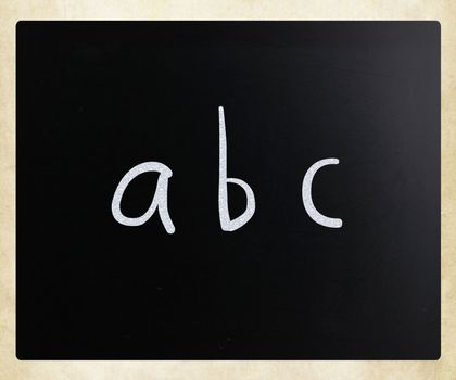 "abc" handwritten with white chalk on a blackboard