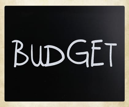 "Budget" handwritten with white chalk on a blackboard