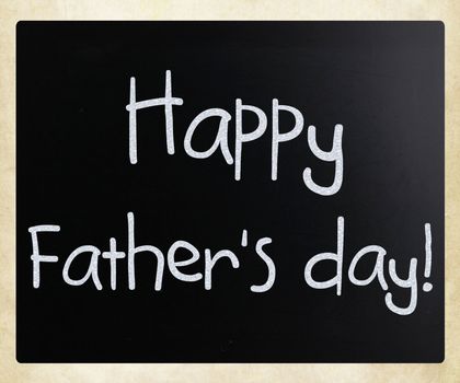 "Happy father's day" handwritten with white chalk on a blackboard