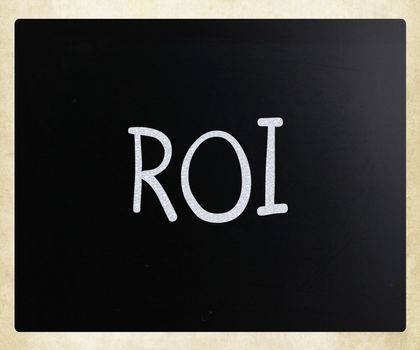 The word "ROI" handwritten with white chalk on a blackboard