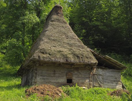 A very traditional house, specific for Motilor Country in Transylvania,Romania. These houses are made exclusively of wood without any piece of iron. Now such buildings are used in wild areas as stalls or barns for animals.
