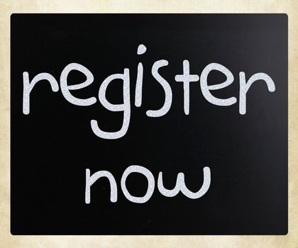 "Register now" handwritten with white chalk on a blackboard
