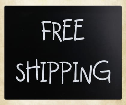 "Free shipping" handwritten with white chalk on a blackboard