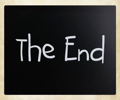 "The End" handwritten with white chalk on a blackboard