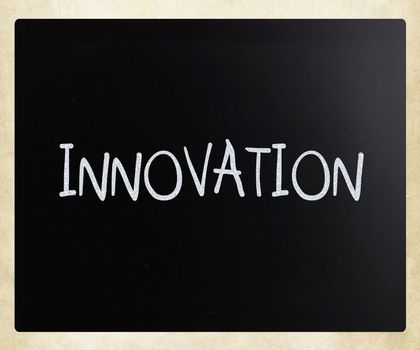 "Innovation" handwritten with white chalk on a blackboard