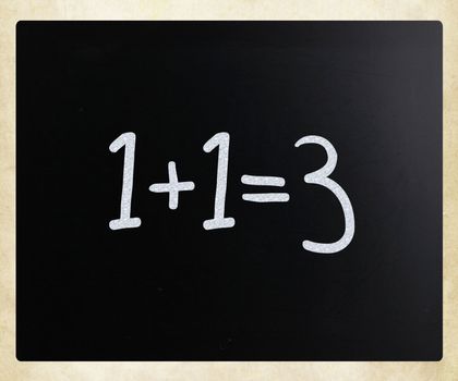 "1+1=3" handwritten with white chalk on a blackboard