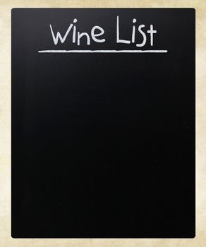 "Wine list" handwritten with white chalk on a blackboard