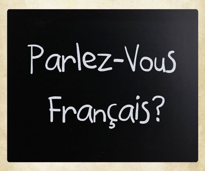 "Parlez-Vous Français?" handwritten with white chalk on a blackboard