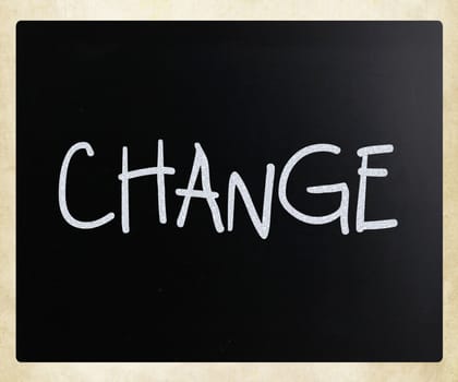 "Change" handwritten with white chalk on a blackboard