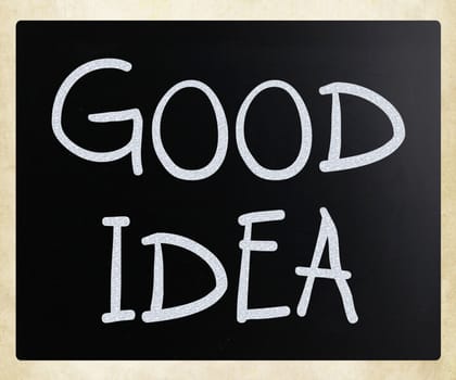 "Good idea" handwritten with white chalk on a blackboard